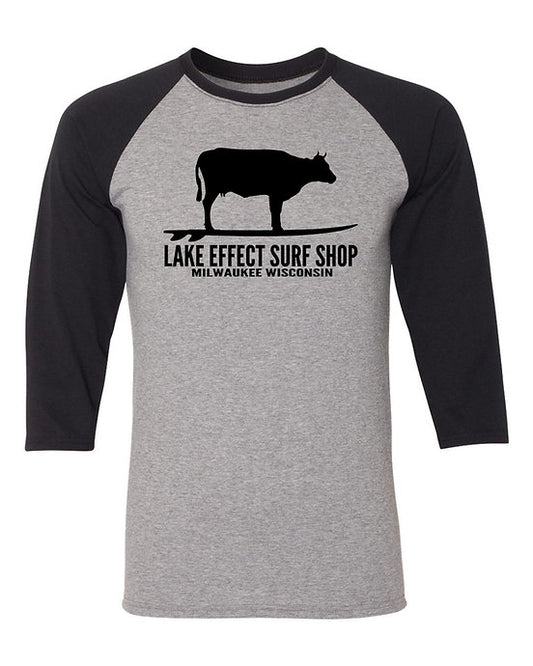 Lake Effect Surfing Cow Raglan Three Quarters Sleeve T-Shirt (Black/Grey)